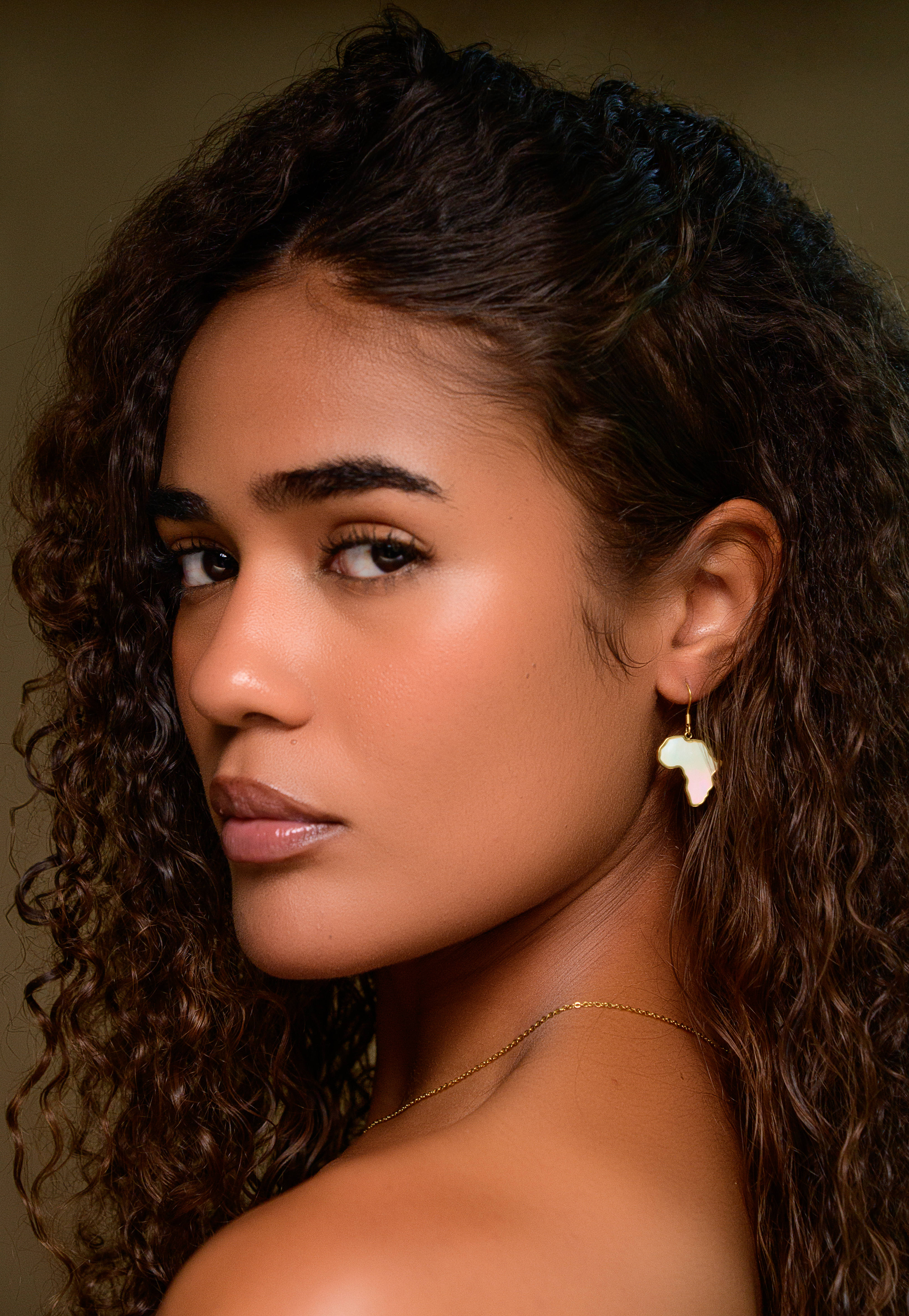 Portrait with an Africa-shaped earring